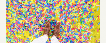 Brown shoes on top of confetti