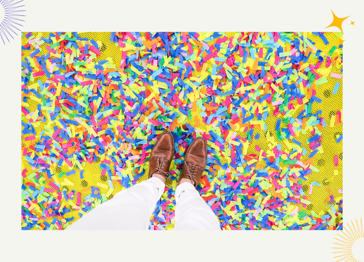 Brown shoes on top of confetti